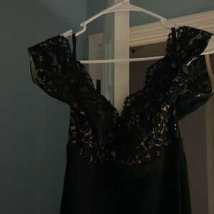 Black, lace, and nude gown.